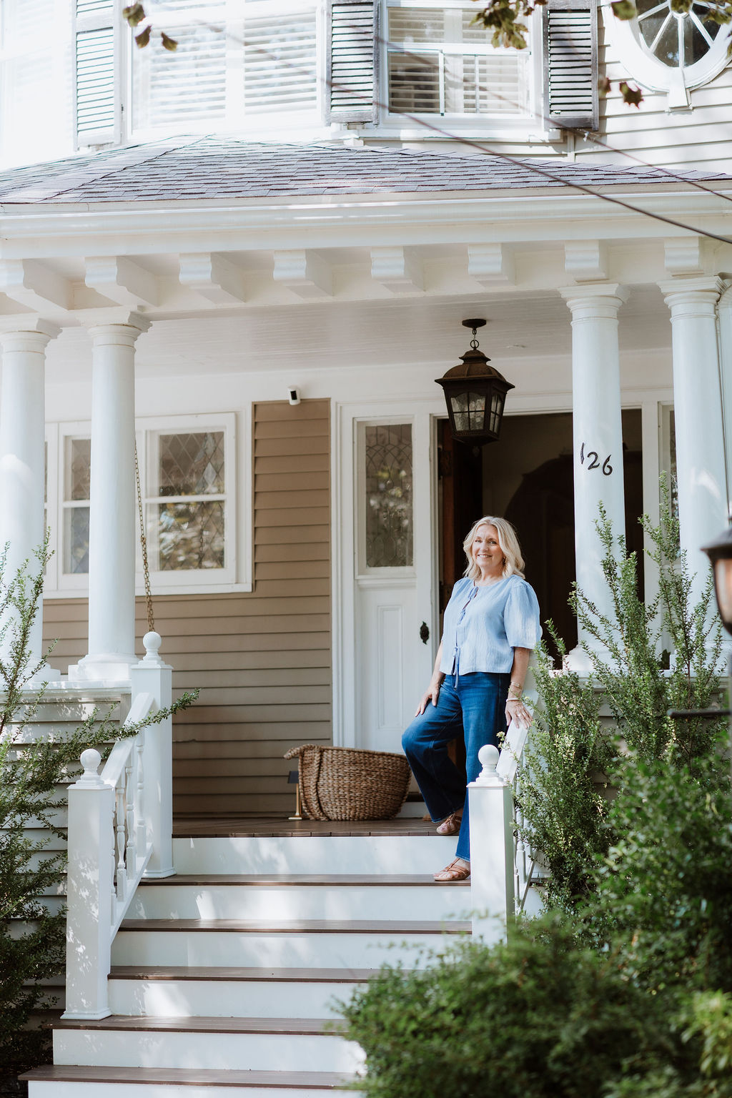 Juli Ford on the porch of a multigenerational home