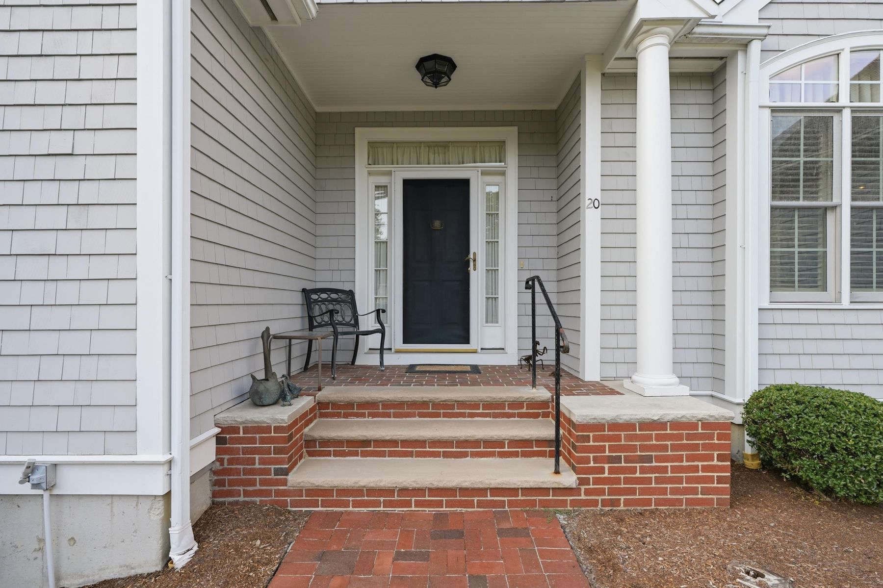 Covered front entry with brick steps