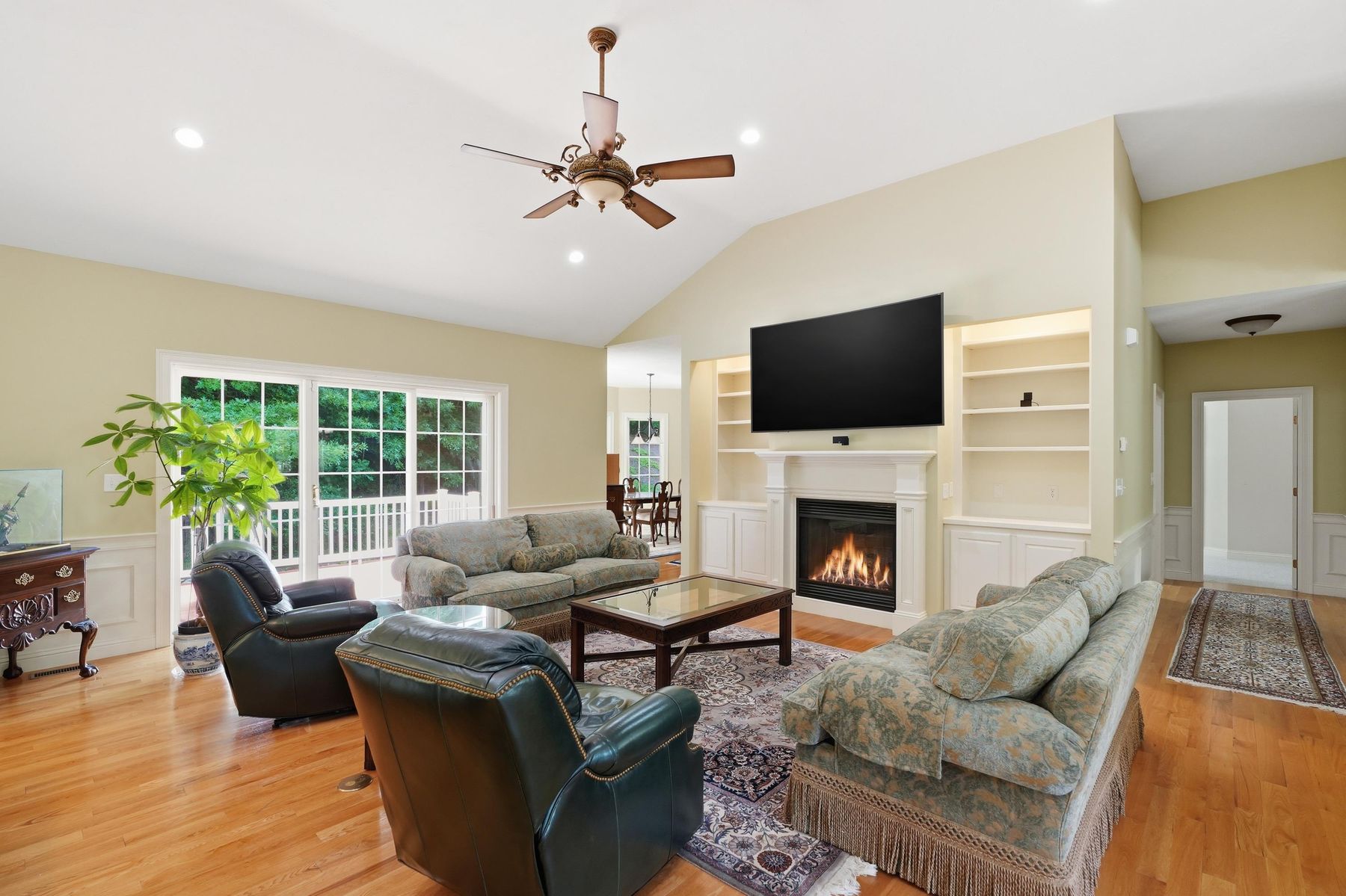 Living room seating area open to the dining room