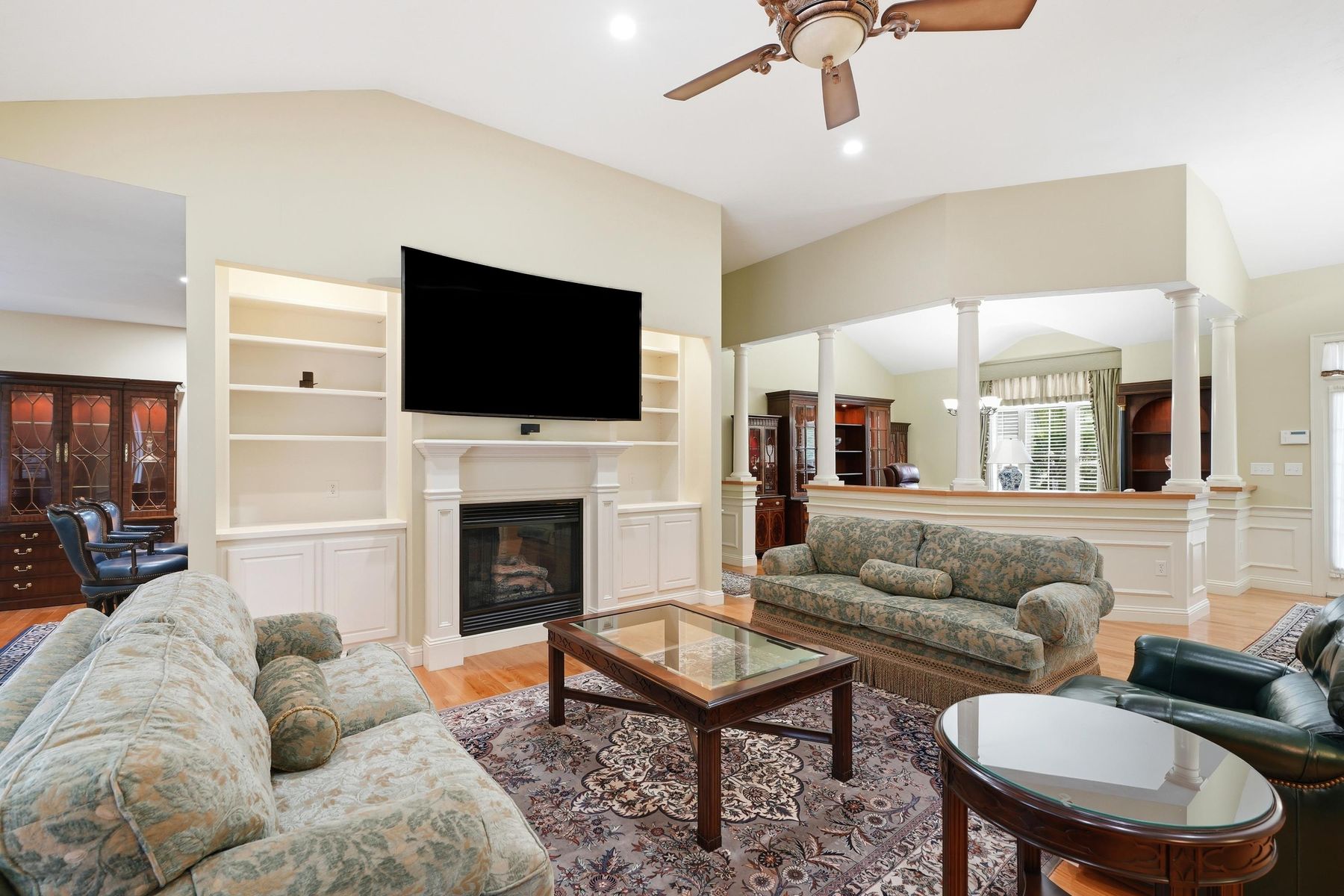 Open living and dining flow with custom built-ins