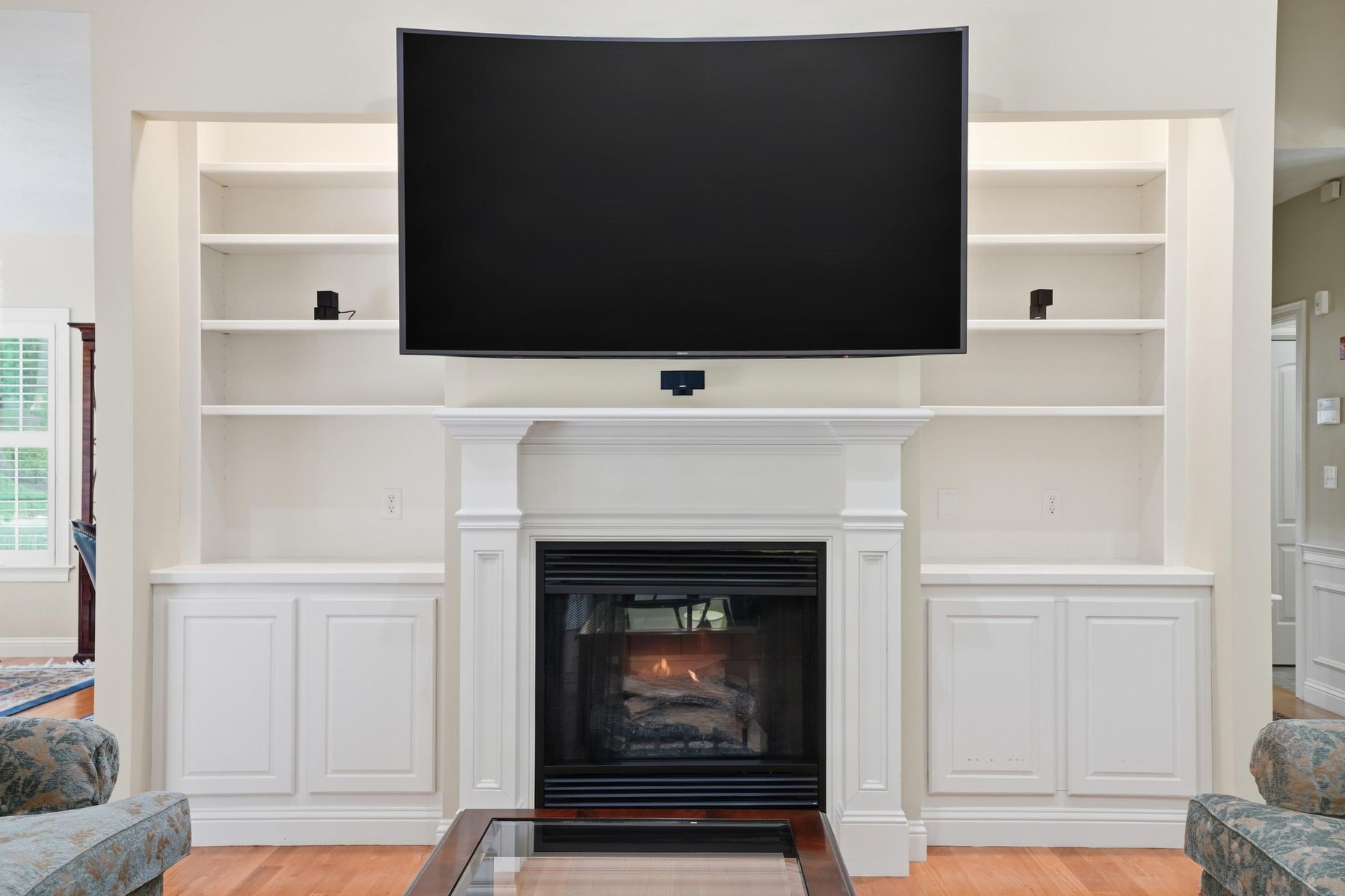 Close view of the fireplace and built-in shelving