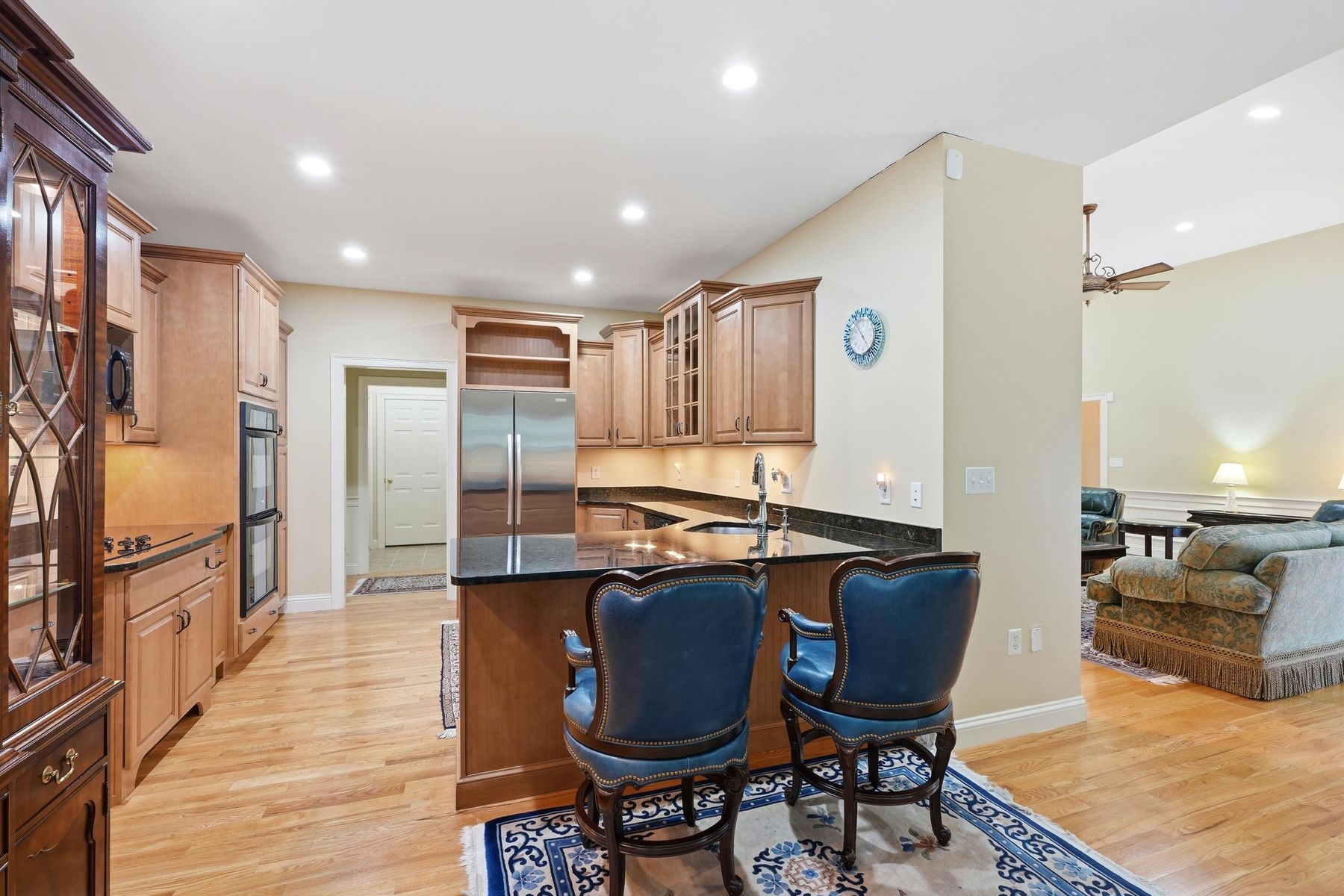 Kitchen island with granite counters and seating for four