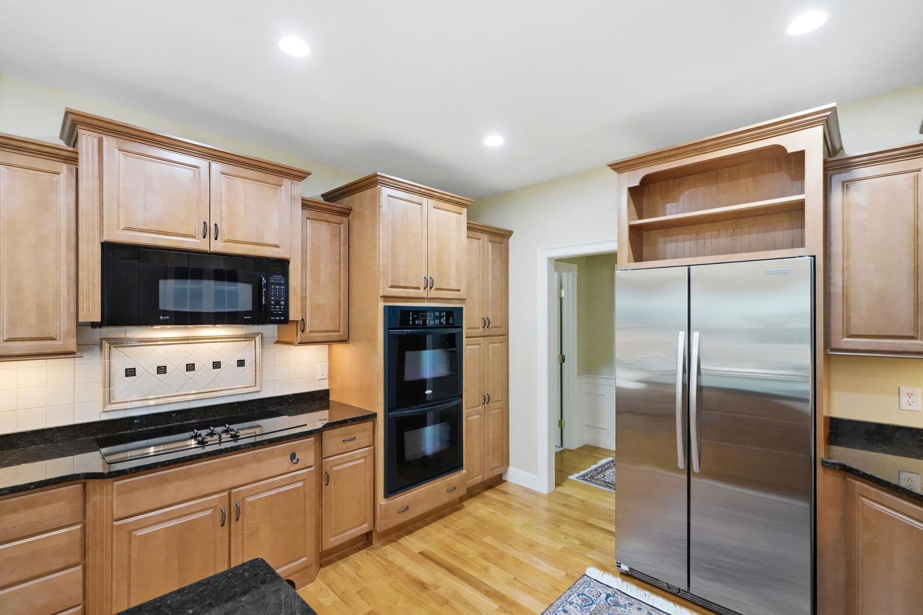 Kitchen cabinetry, cooktop and pantry storage