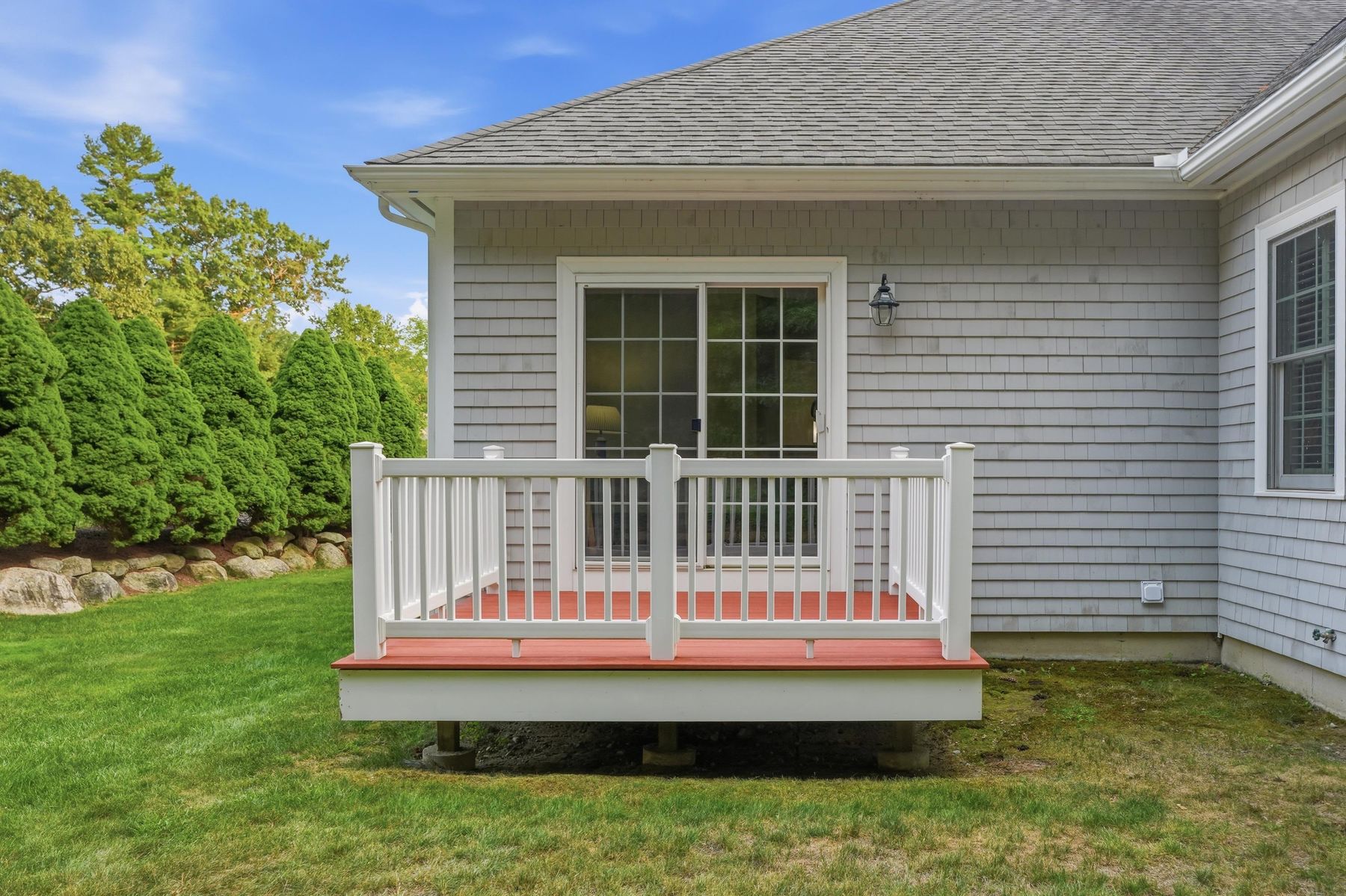 Back of the home with raised deck