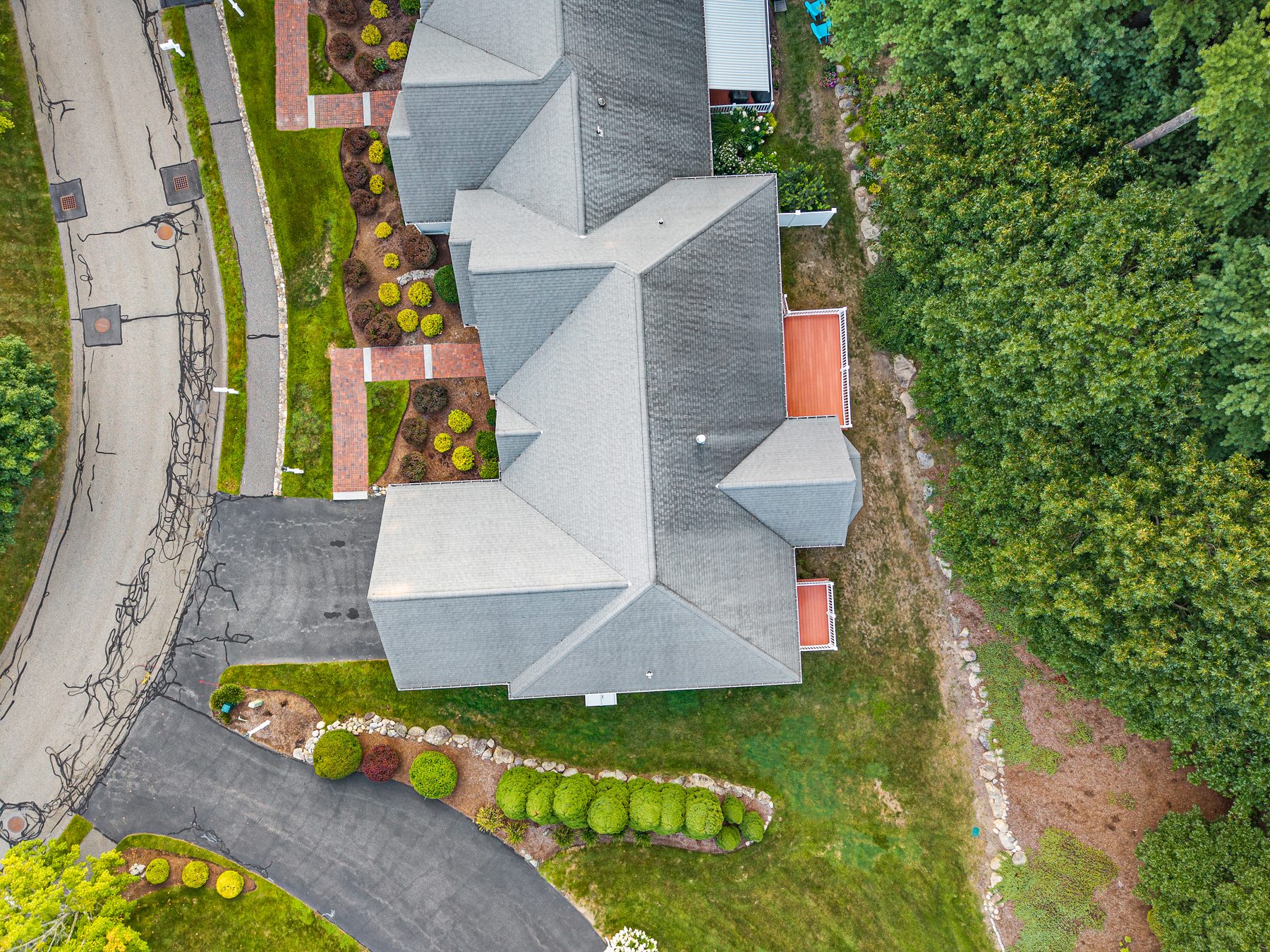 Overhead aerial of the rooftop, deck and surrounding green space