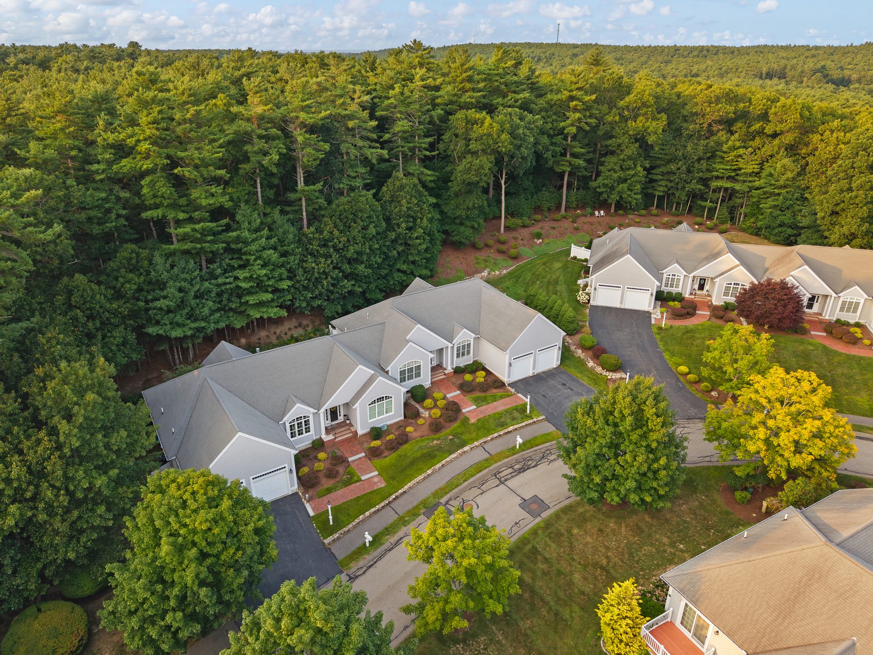Elevated drone view of the home within Overlook Farm
